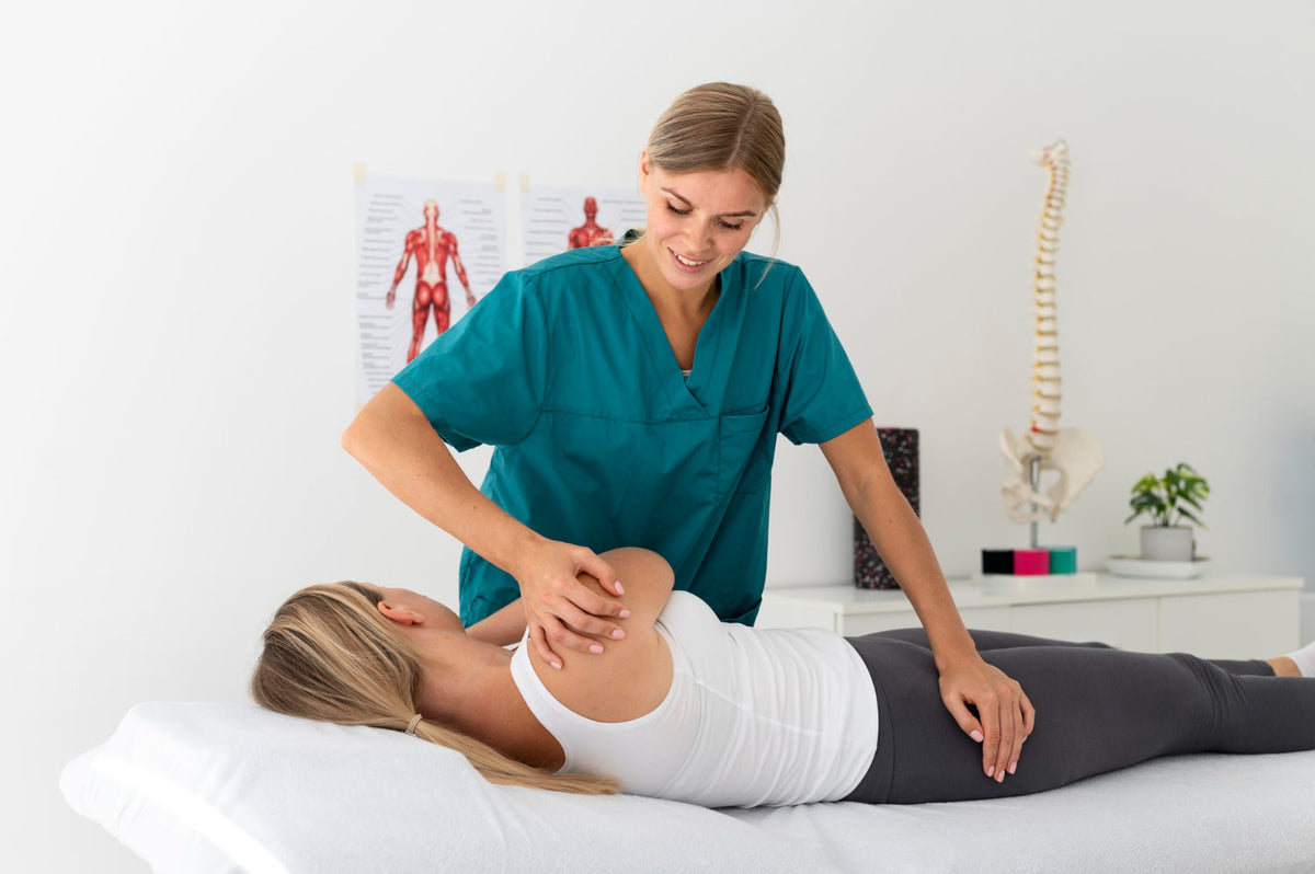 Best chiropractor in Dubai performs a spinal adjustment on a female patient lying on a treatment table inside a modern clinic.