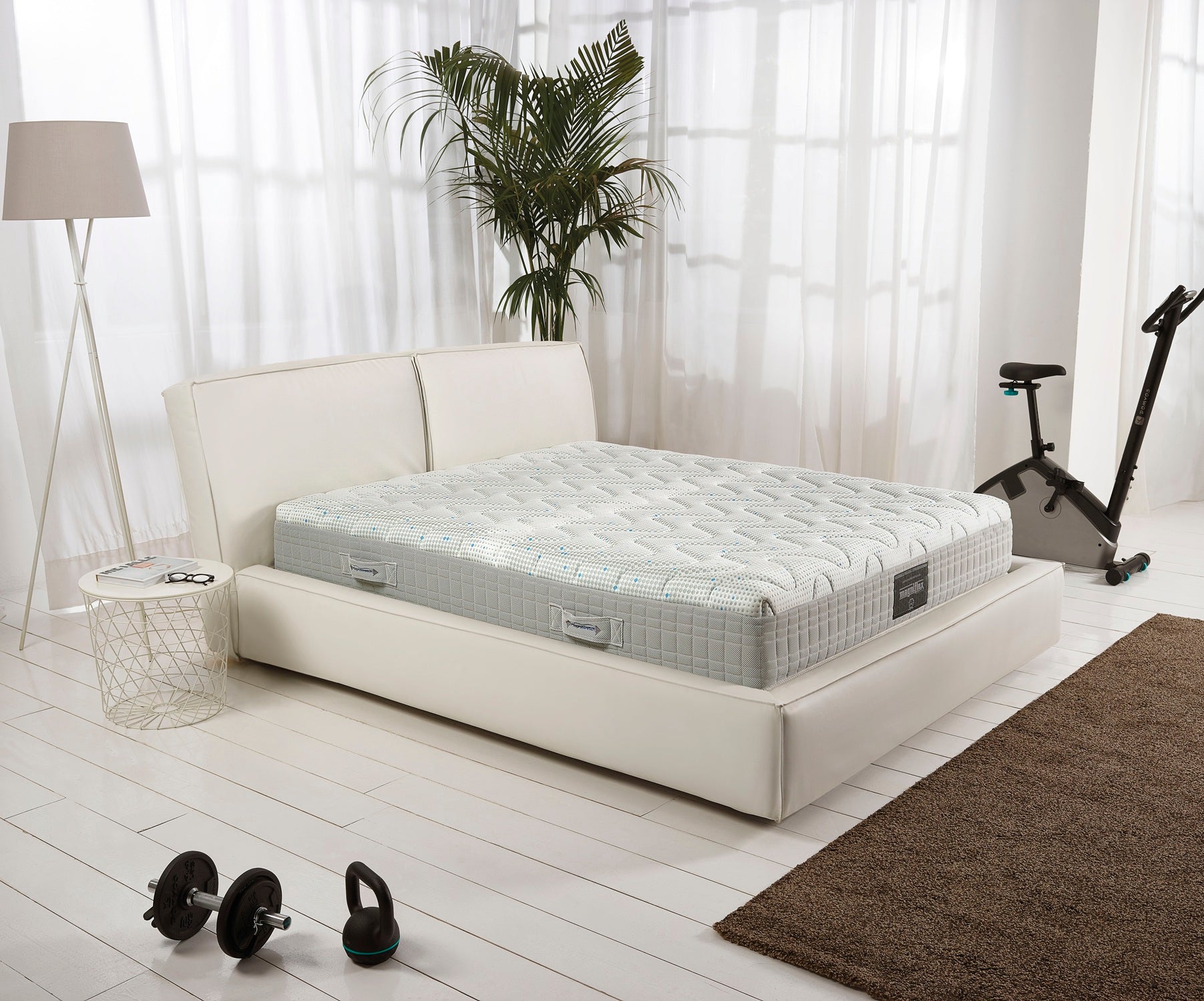 MagniStretch 9 mattress in a modern minimalist bedroom.